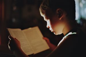 boy book reading literature read education study studying knowledge focus student kid child young Stay Awake While Studying: Tips to Fight Off Sleepiness